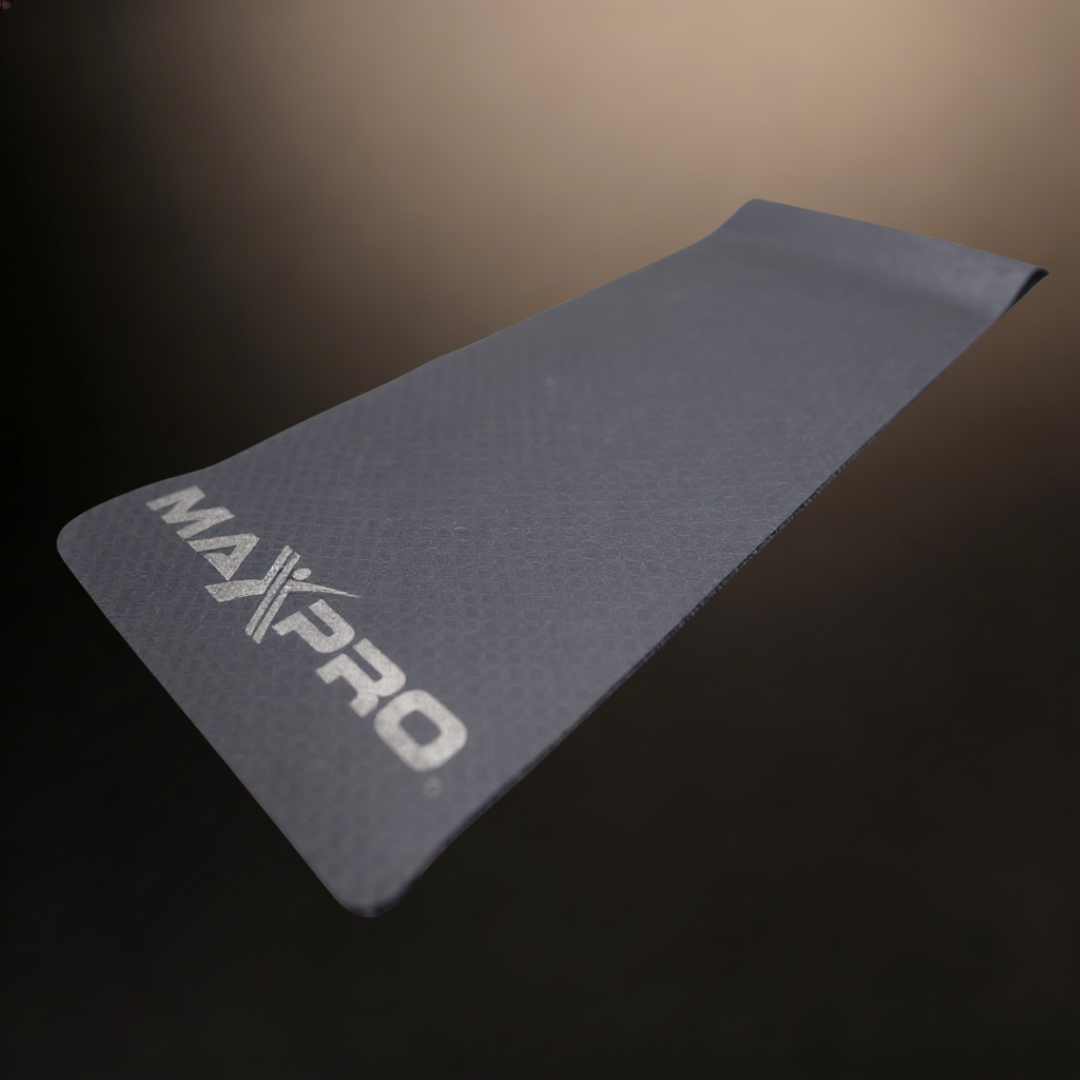 exercise mat with MAXPRO written on it with a black gold background