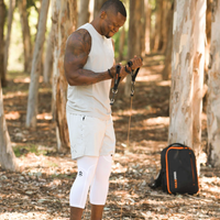 Man exercising with a MAXPRO in a forest setting