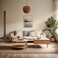 Modern living room with a MAXPRO mounted on the wall with gray sofa, wooden coffee table, and decorative elements showing how the MAXPRO can blend into your space. 