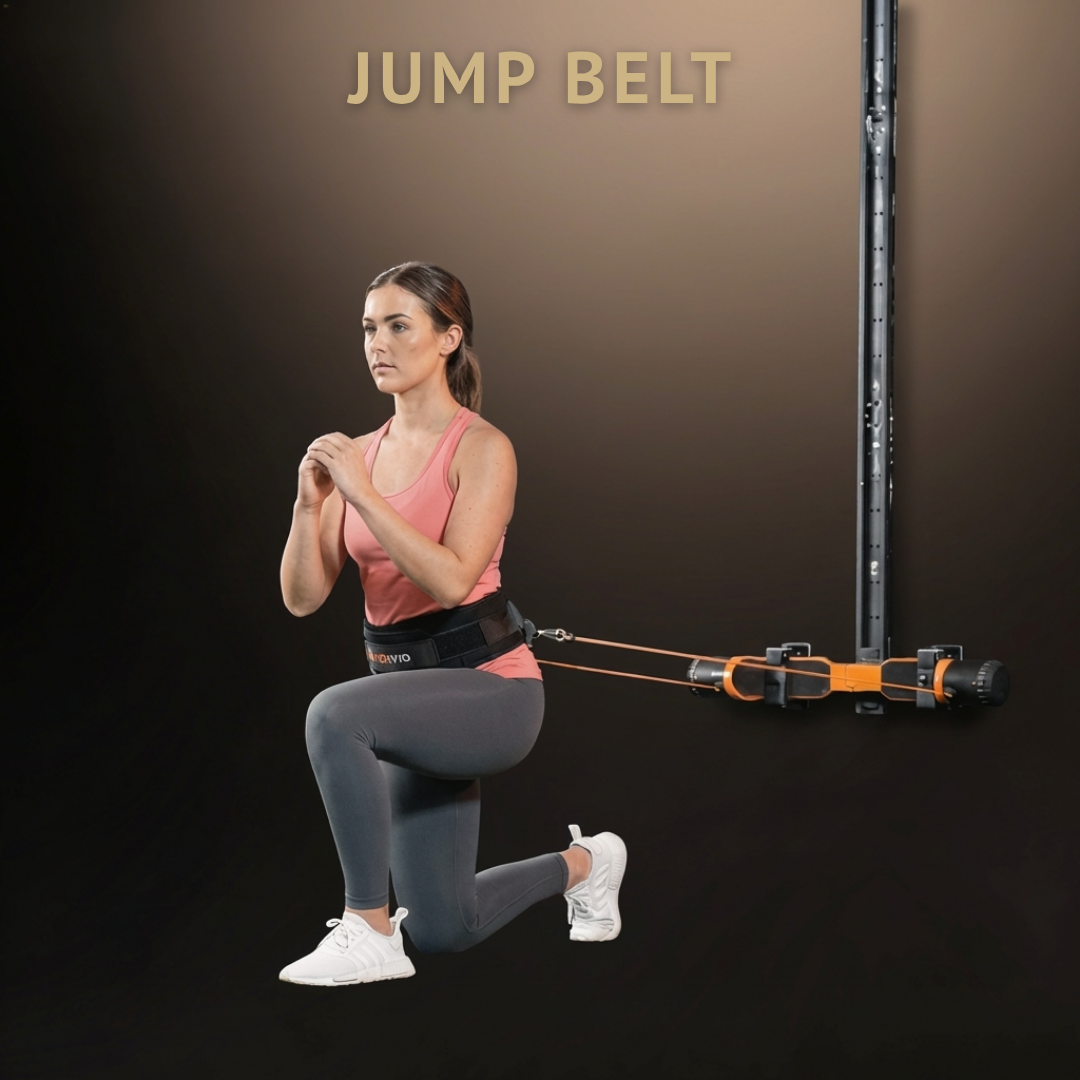 female wearing a jumpbelt squatting with maxpro on a wall track