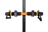 Front view of an orange MAXPRO cable trainer secured to a black SlimLine Wall Track, with two handles attached.