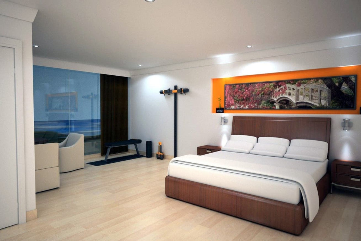 MAXPRO cable trainer mounted high on a SlimLine Wall Track beside a workout bench in a modern bedroom